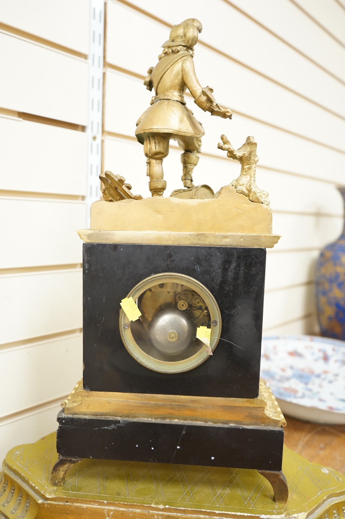 A 19th century French gilt metal mantel clock and stand, 56cm total